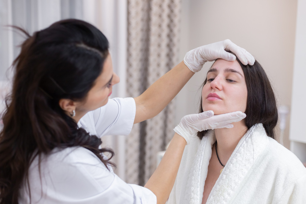 Woman receiving a facial aesthetic treatment at Glow Skin Dental Clinic